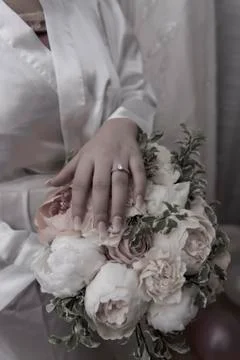 Wedding ring with bride hand Stock Photos