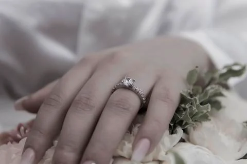 Wedding ring with bride hand Stock Photos