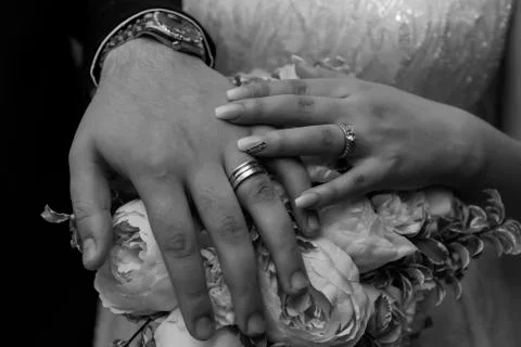 Wedding ring with bride hand Stock Photos