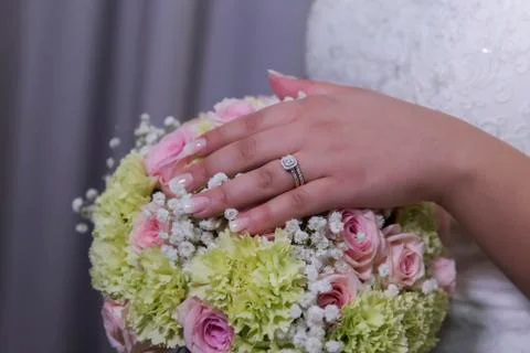 Wedding ring with bride hand Stock Photos