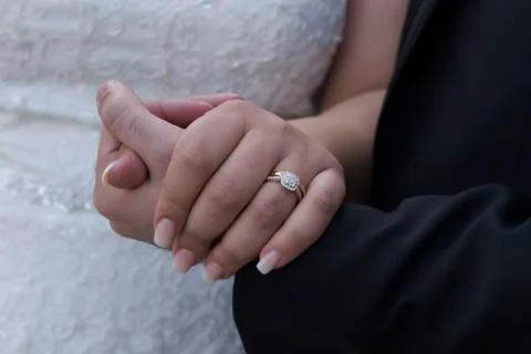 Wedding ring with bride hand Stock Photos