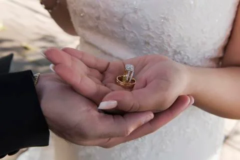 Wedding ring with bride hand Stock Photos