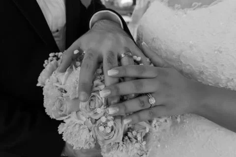 Wedding ring with bride hand Stock Photos