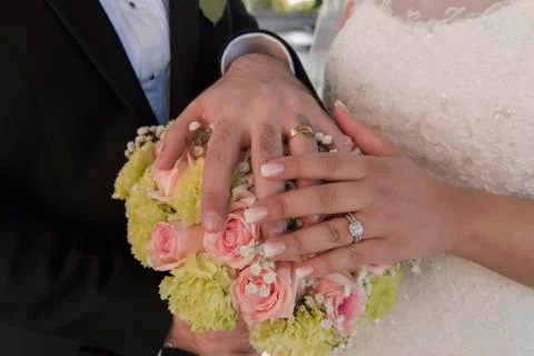 Wedding ring with bride hand Stock Photos