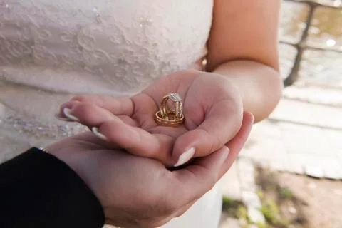 Wedding ring with bride hand Stock Photos