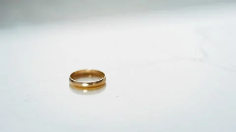 Wedding ring falling Stock Footage 61827961