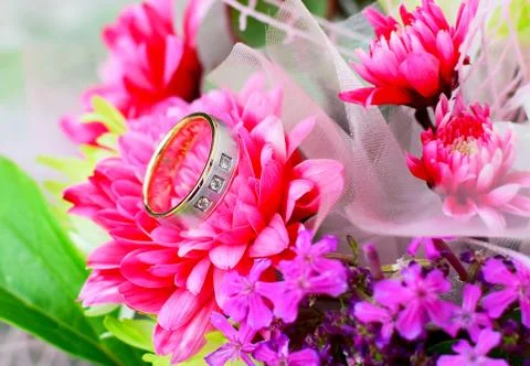 Wedding ring with flowers Stock Photos