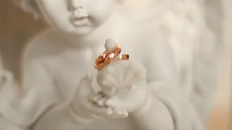 Wedding ring on the hand of a statuette. Stock Footage 81812668
