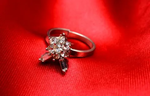 Wedding Ring Isolated on Red Shiny Background Foto stock