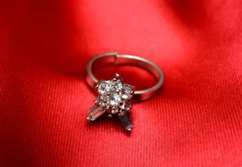 Wedding Ring Isolated on Red Shiny Background Stock Photos