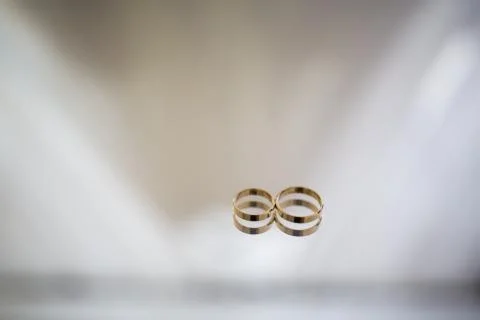 Wedding ring on a mirror table.reflection Stock Photos