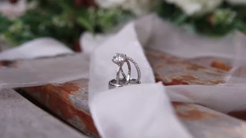 Wedding ring on natural wood table. Stock Footage 134847349
