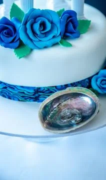 Wedding ring on a paua shell, wedding accessories, celebration details Stock Photos