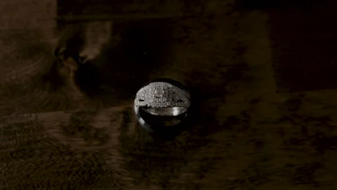 Wedding Ring Pull To Out of Focus Stock Footage 243880660