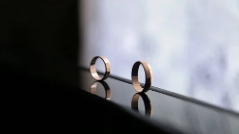 Wedding ring rolls and falls 스톡 동영상 123782836