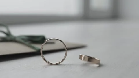 The wedding ring is spinning on the table Video stock 306148129