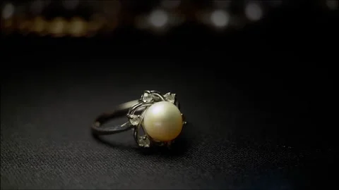 Wedding ring through dramatic light Stock Footage 317415192