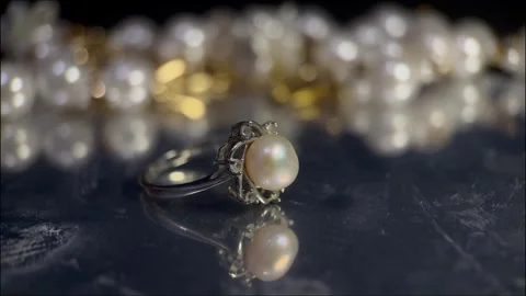 Wedding ring through dramatic light Stock Footage 317415195