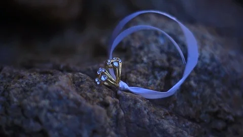 Wedding ring video shot on rock background Stock Footage 92864664