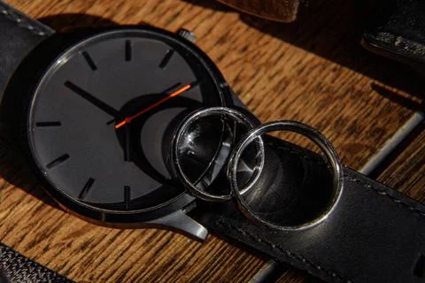 Wedding ring on the watch Stock Photos