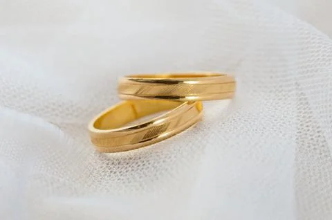 Wedding ring on white veil Stock Photos
