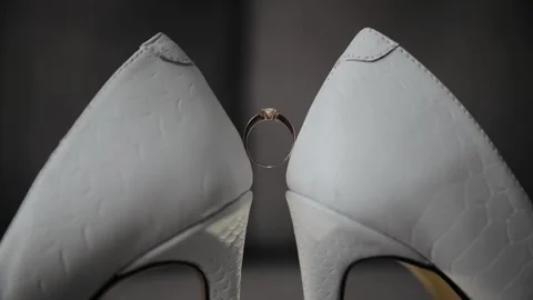 Wedding ring on woman's white shoes. Beautiful wedding ring Stock Footage 234917363