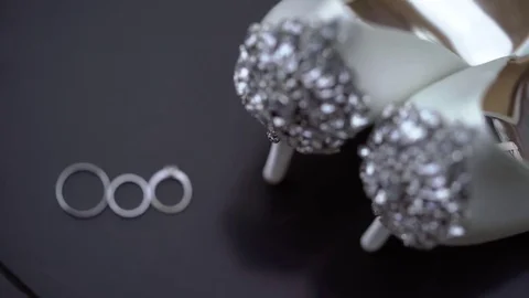 Wedding rings and shoes Stock Footage