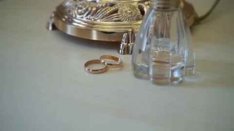 Wedding rings are on the table Stock Footage 163567108