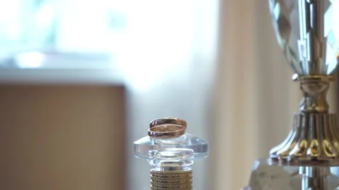 Wedding rings are on the table Stock Footage 163567120