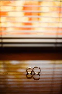 Wedding rings on the blinds Stock Photos