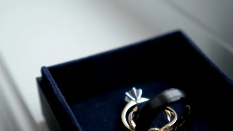 Wedding rings in blue box Stock Footage 104611465