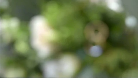 Wedding rings on a bouquet Video stock 71370983