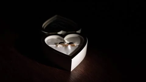 Wedding rings in a box, a casket in the shape of a heart. Stock Footage 231596146
