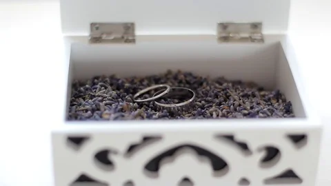 Wedding rings in a box decor lavender   soft focus Stock Footage 71948418