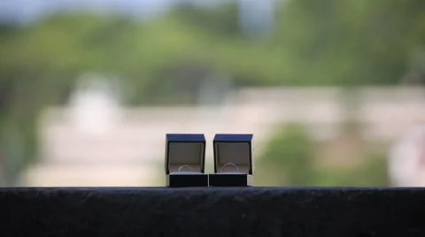 Wedding rings in the boxes on the balcony on a background of an exotic city Stock Footage 44877280