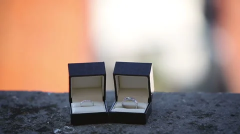 Wedding rings in the boxes on the balcony on a background of an exotic city Stock Footage 44877565