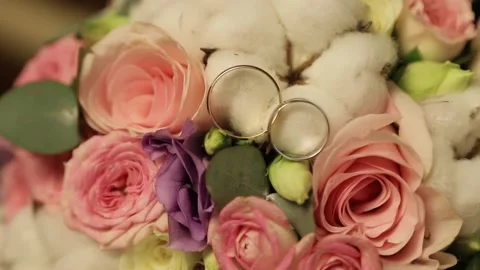 Wedding rings on the bride's bouquet Stock Footage