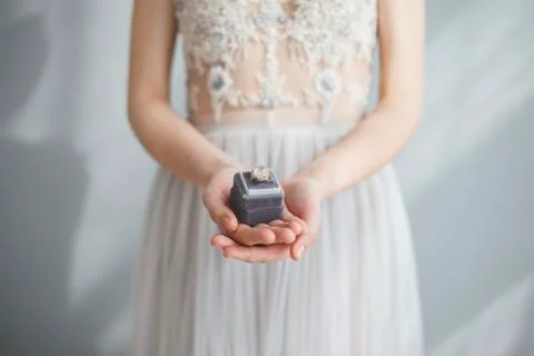 Wedding rings in bride's hands Stock Photos