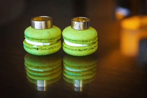 Wedding rings with brilliants on macarons Stock Photos