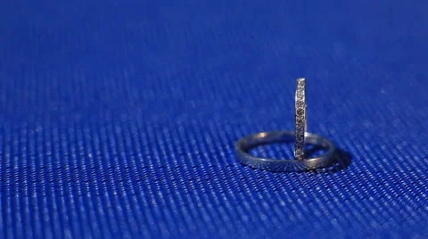 Wedding rings close-up on blue background Stock Footage 52505750