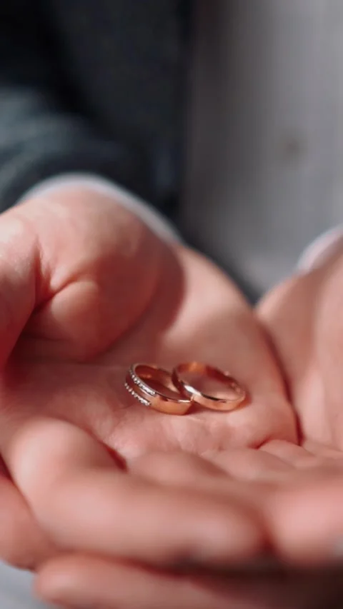 Wedding rings close-up lie on the table during the wedding celebration Stock Footage 252267864