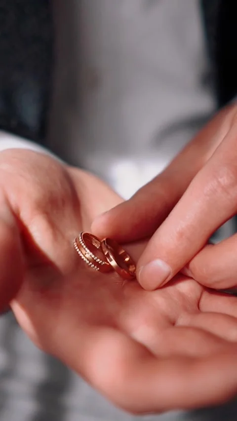 Wedding rings close-up lie on the table during the wedding celebration Stock Footage 252267912