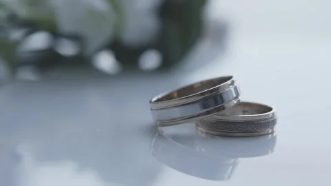 Wedding rings close up on table Video stock 306148599