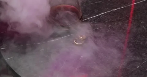 Wedding rings close-up, whiskey and hookah smoke Stock Footage 221573885