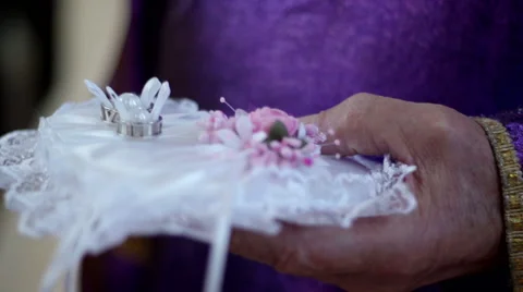 Wedding rings on cushion Stock Footage 54197155