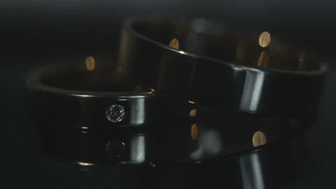 Wedding rings on dark background Stock Footage 87477489