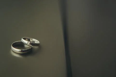 Wedding rings on the dark background 스톡 사진