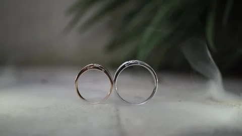 Wedding rings on a floor with smoke Stock Footage 140239624