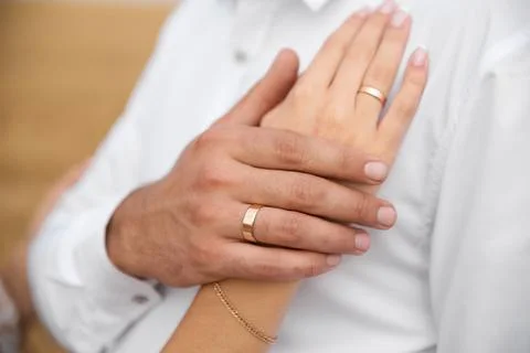Wedding rings on hands close-up Stock Photos