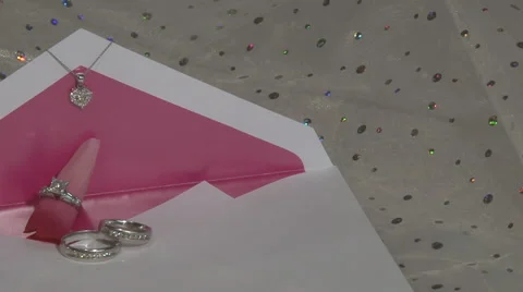 Wedding Rings on Invitation Stock Footage 2673831
